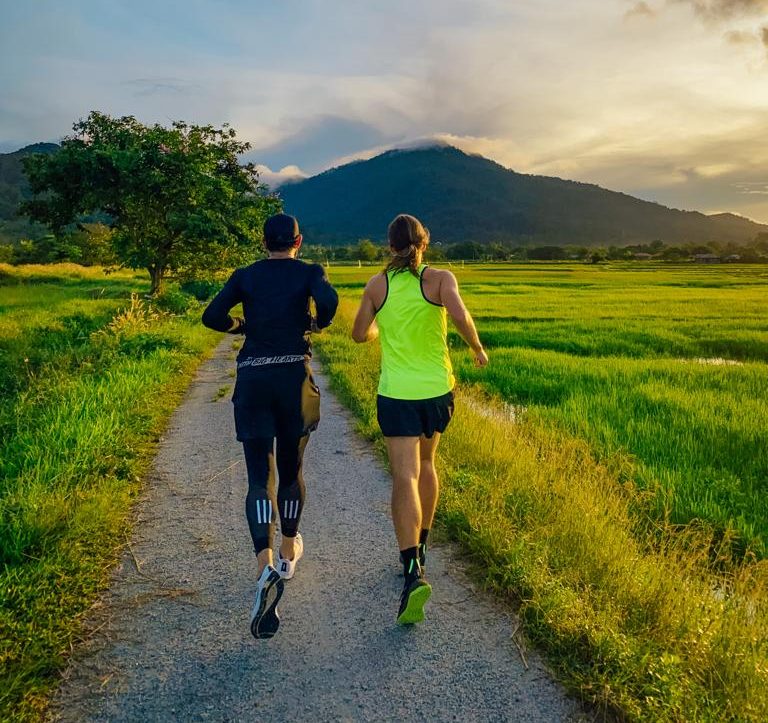 Trail running through tropical jungle